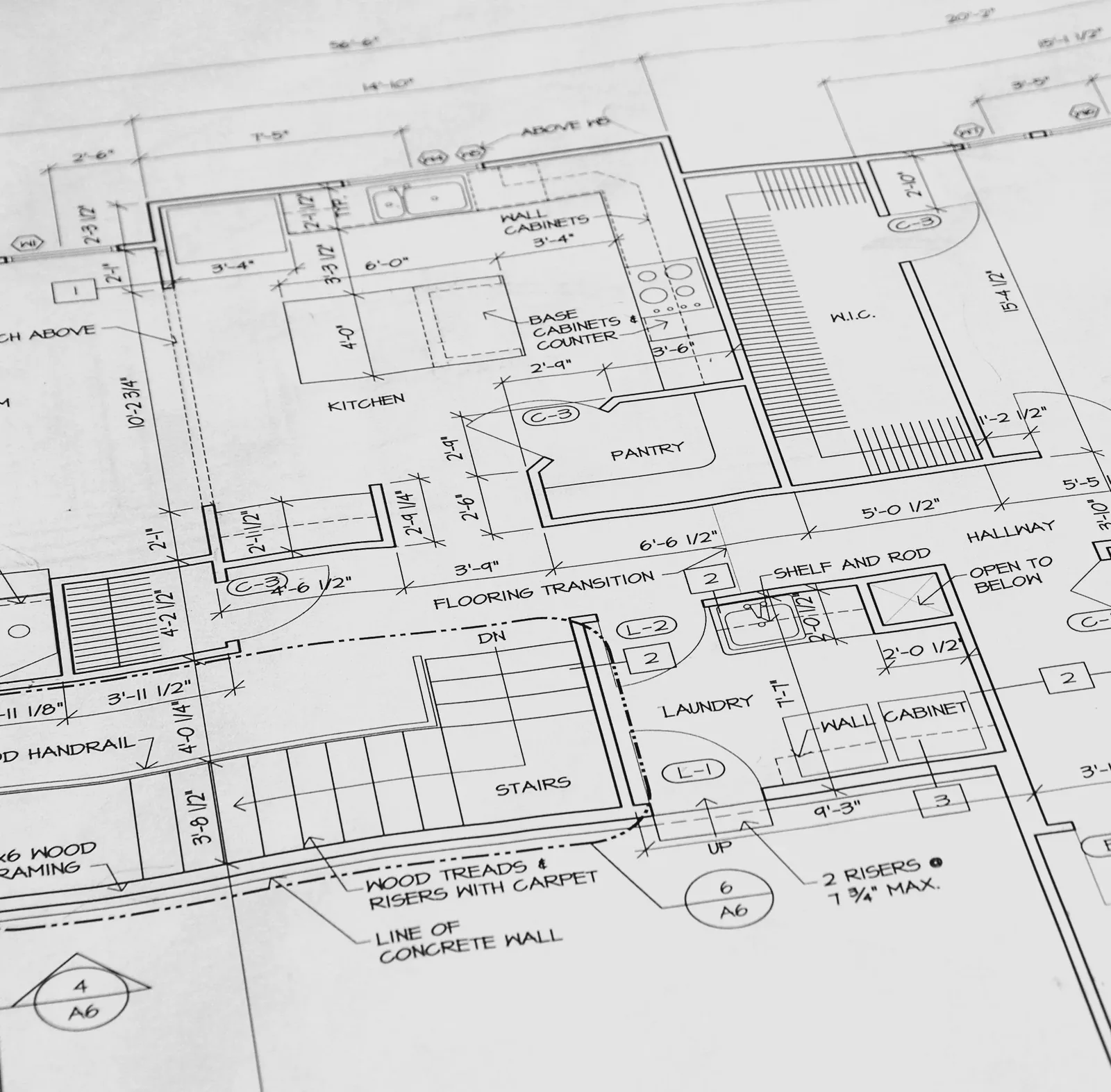 Rolled architectural floor plan showing a kitchen, pantry, laundry and stair layout