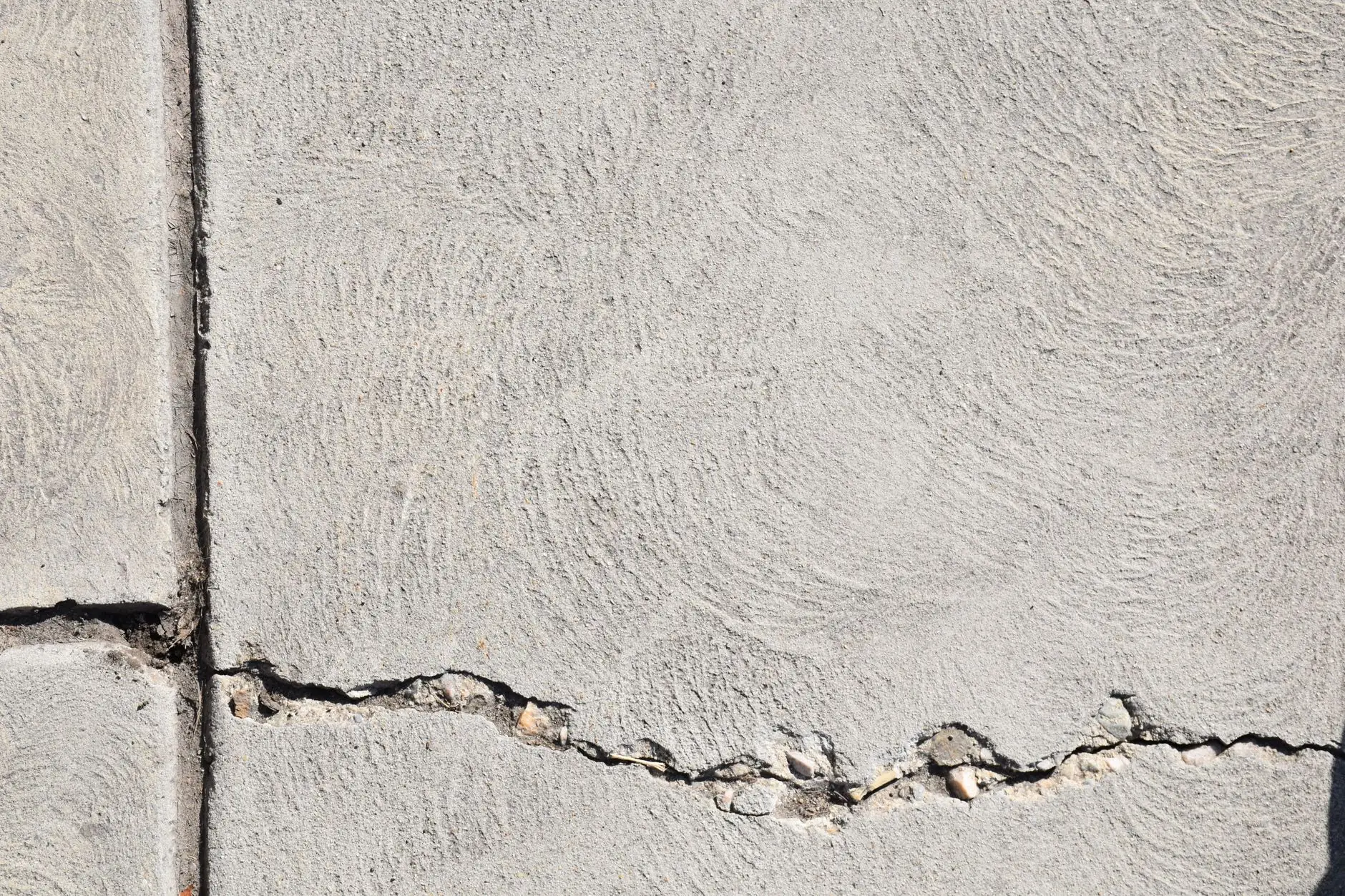 Crack running through a concrete surface before repair work