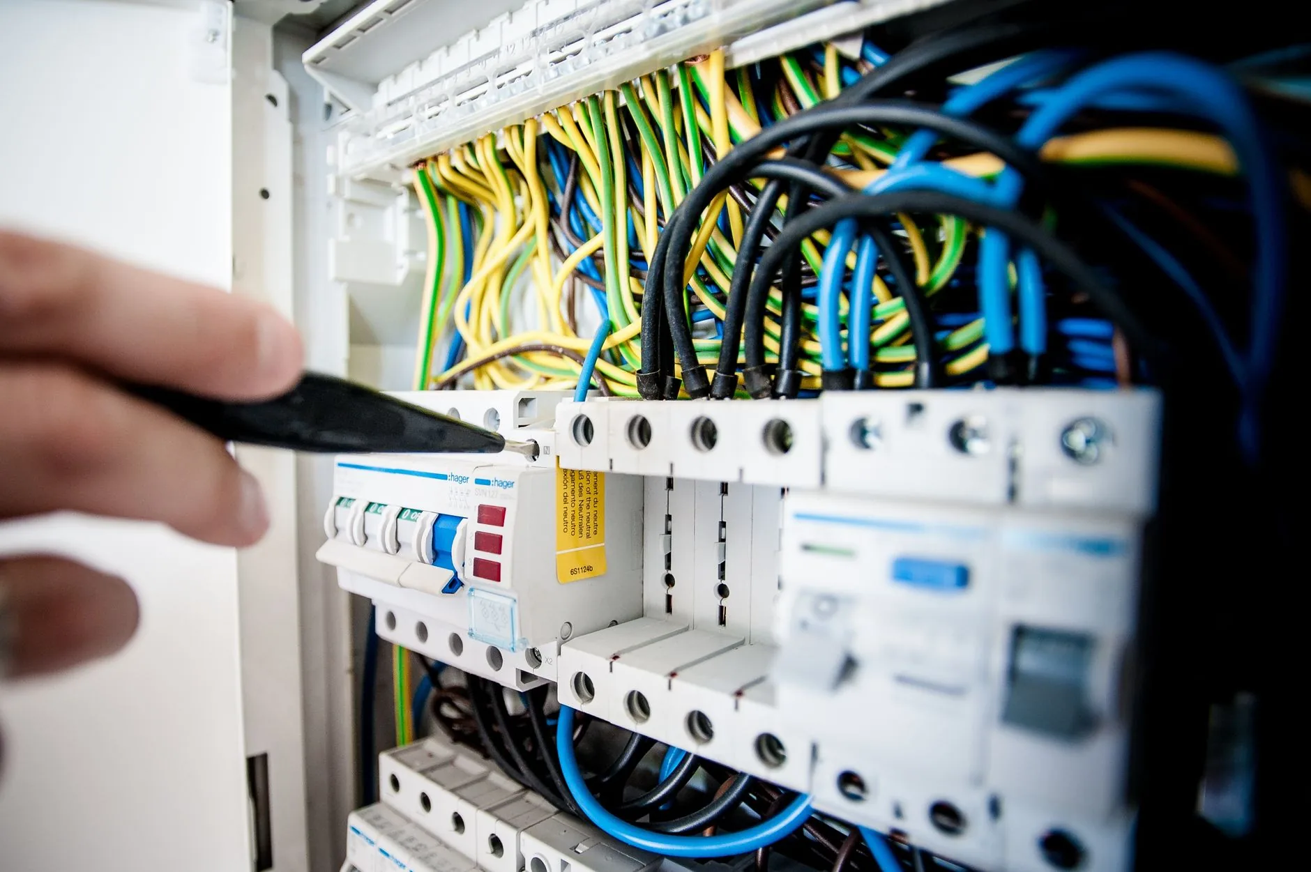 Close view of labeled wires and breakers inside an electrical panel